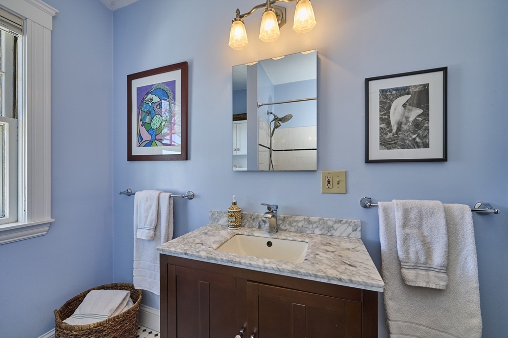 132 Windermere Road Auburndale, MA 02466 - Photo 24 of 38 a bathroom with a granite countertop sink and a mirror