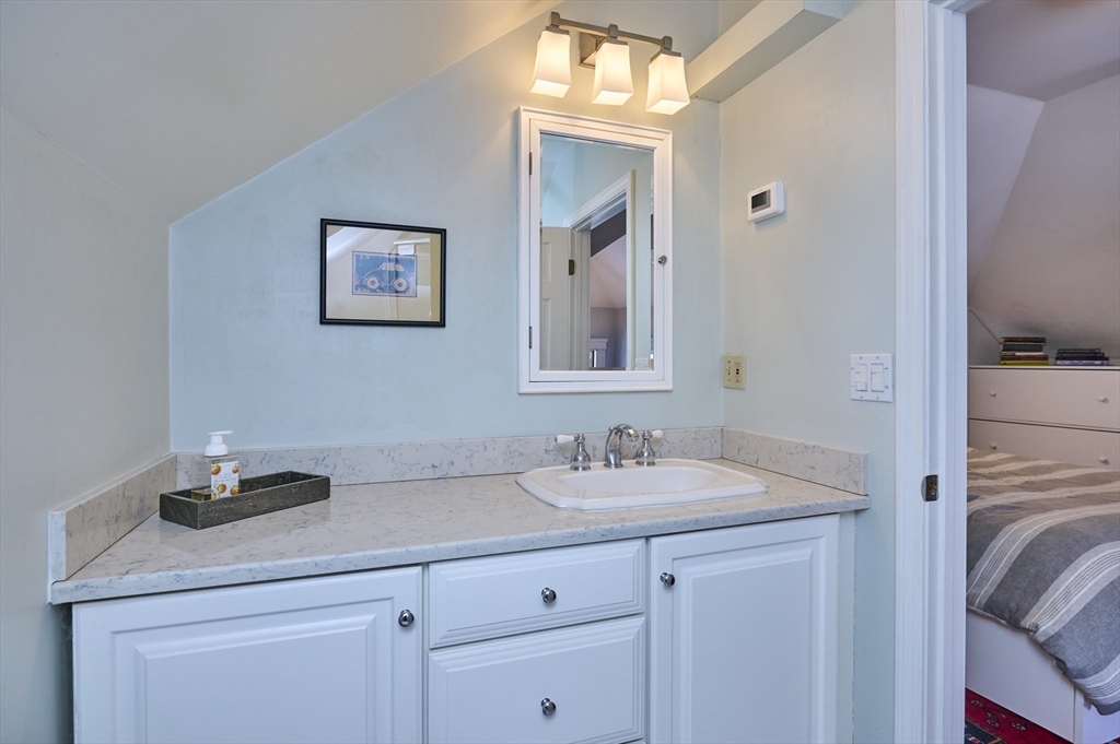 132 Windermere Road Auburndale, MA 02466 - Photo 29 of 38 a bathroom with a sink and a mirror