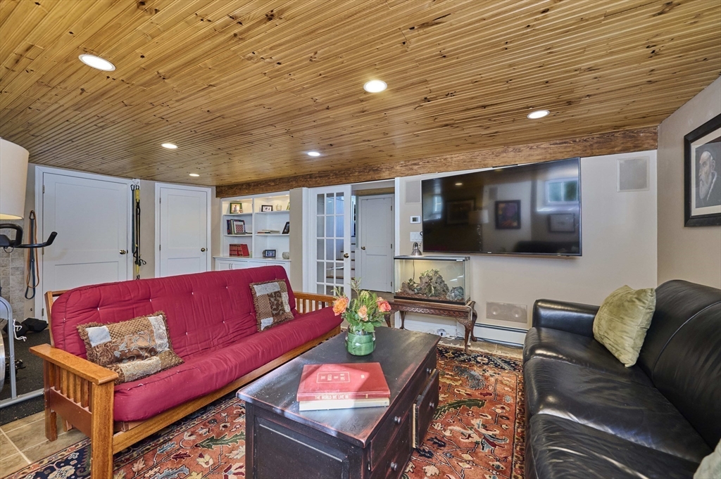 132 Windermere Road Auburndale, MA 02466 - Photo 30 of 38 a living room with furniture and a flat screen tv