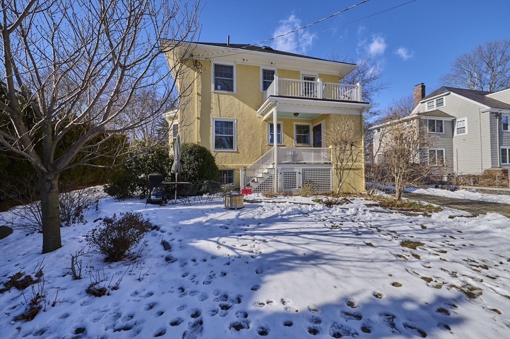 132 Windermere Road Auburndale, MA 02466 - Photo 36 of 38 a view of a white house with a yard