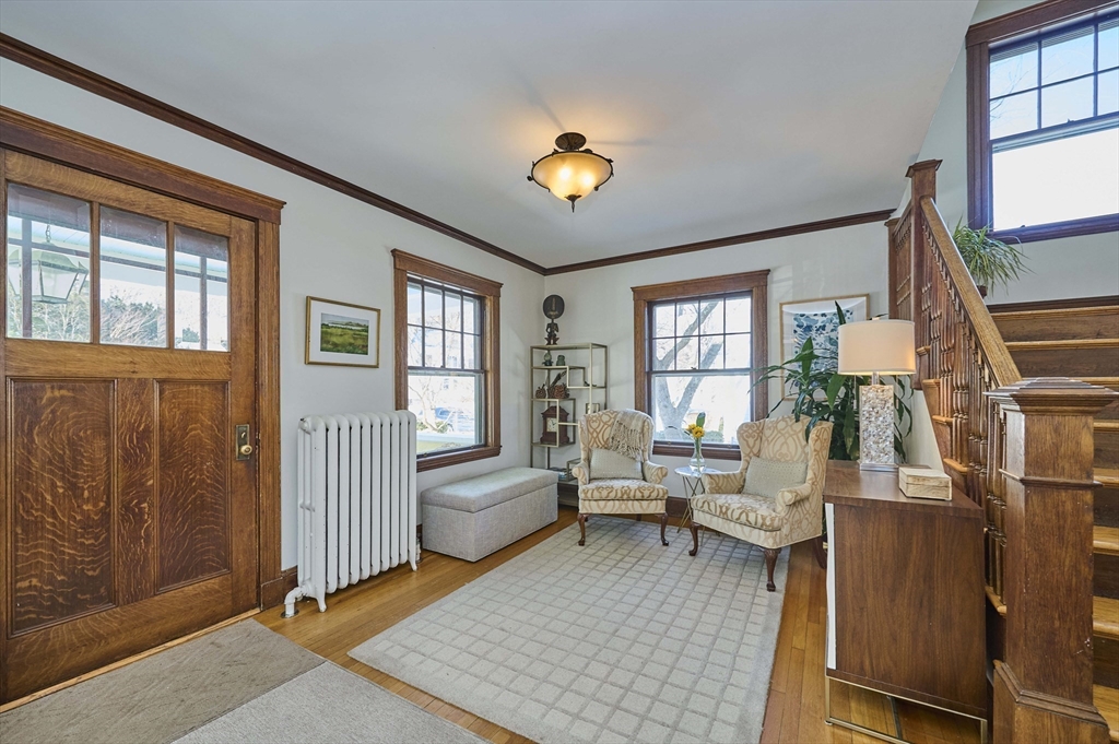 132 Windermere Road Auburndale, MA 02466 - Photo 5 of 38 a living room with furniture a chandelier and a window