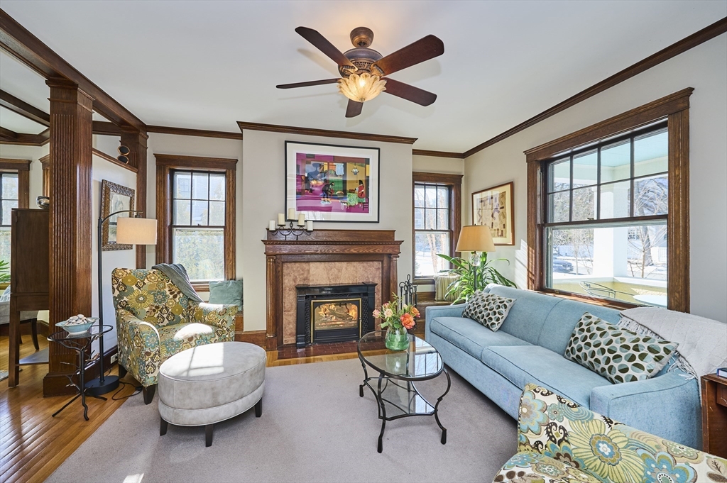 132 Windermere Road Auburndale, MA 02466 - Photo 8 of 38 a living room with furniture a fireplace and a large window