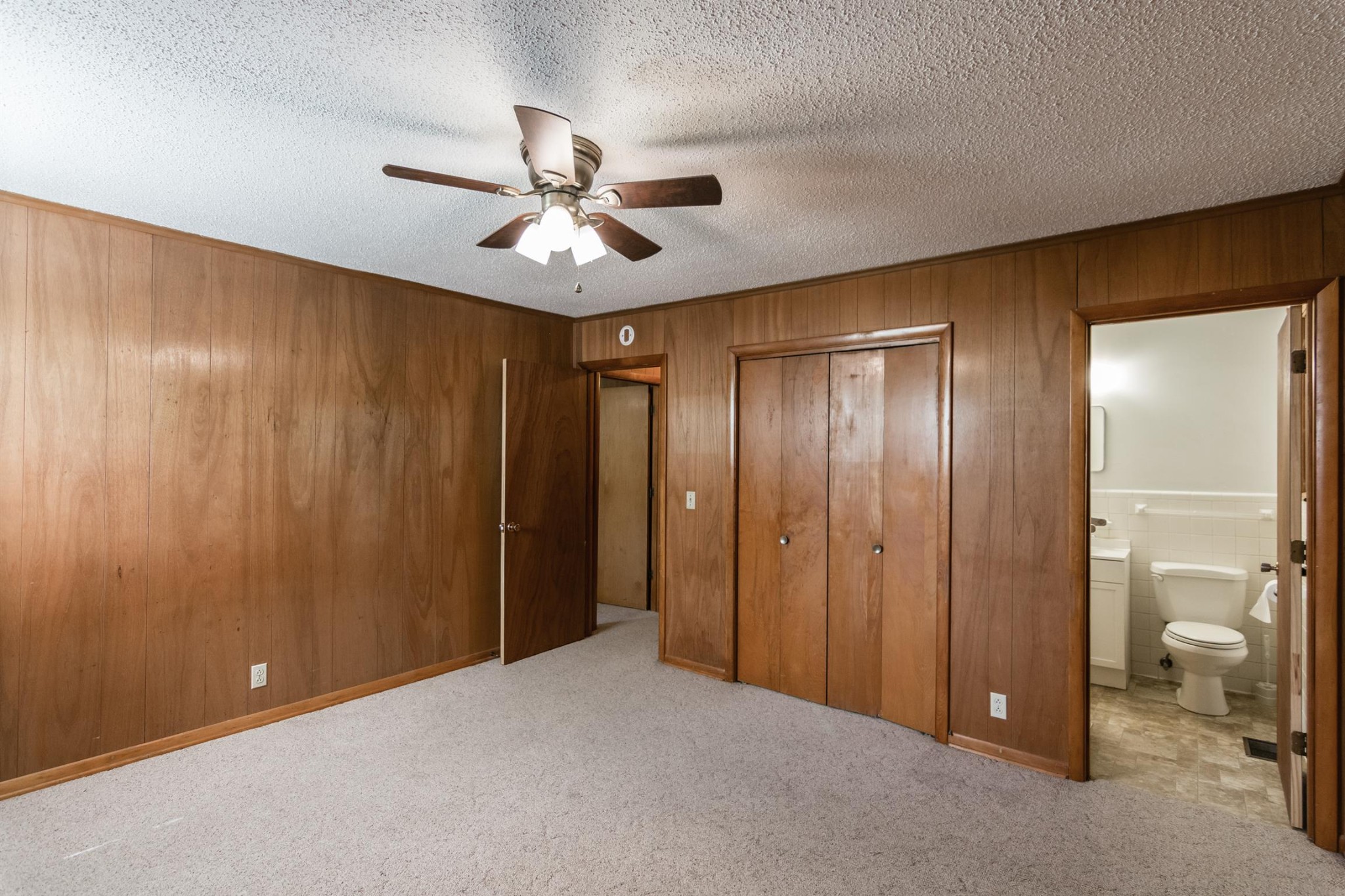 5124 Ridge Hill Road Joelton, TN 37080 - Photo 13 of 27 a view of a livingroom with a chandelier fan and closet area