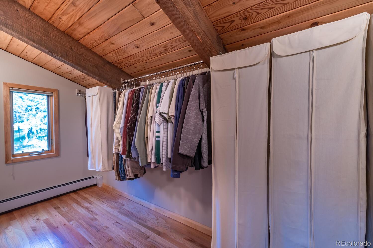 498 Mountain Meadows Road Boulder, CO 80302 - Photo 18 of 40 a view of walk in closet with clothes and shoes