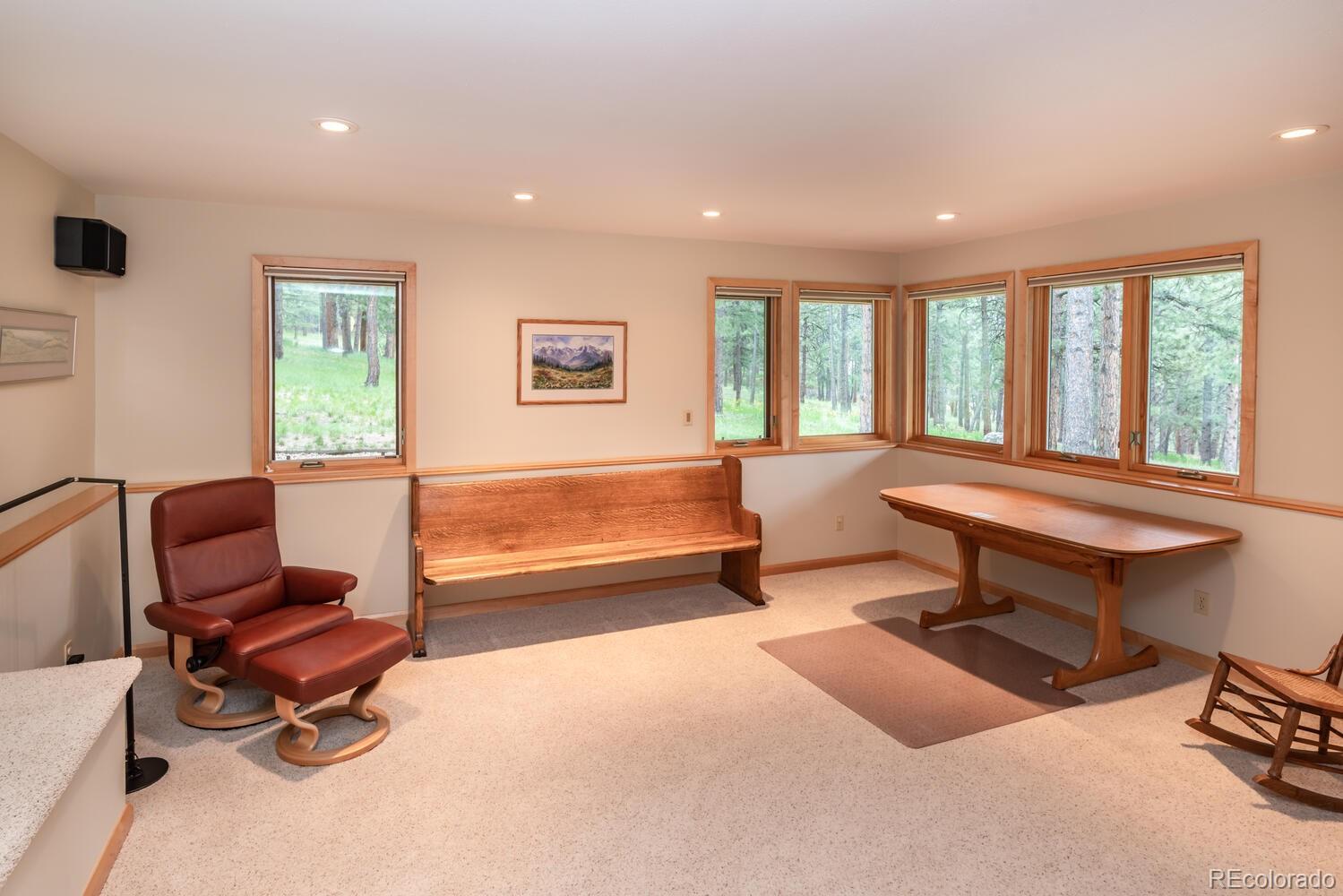 498 Mountain Meadows Road Boulder, CO 80302 - Photo 19 of 40 a living room with furniture a window and a table