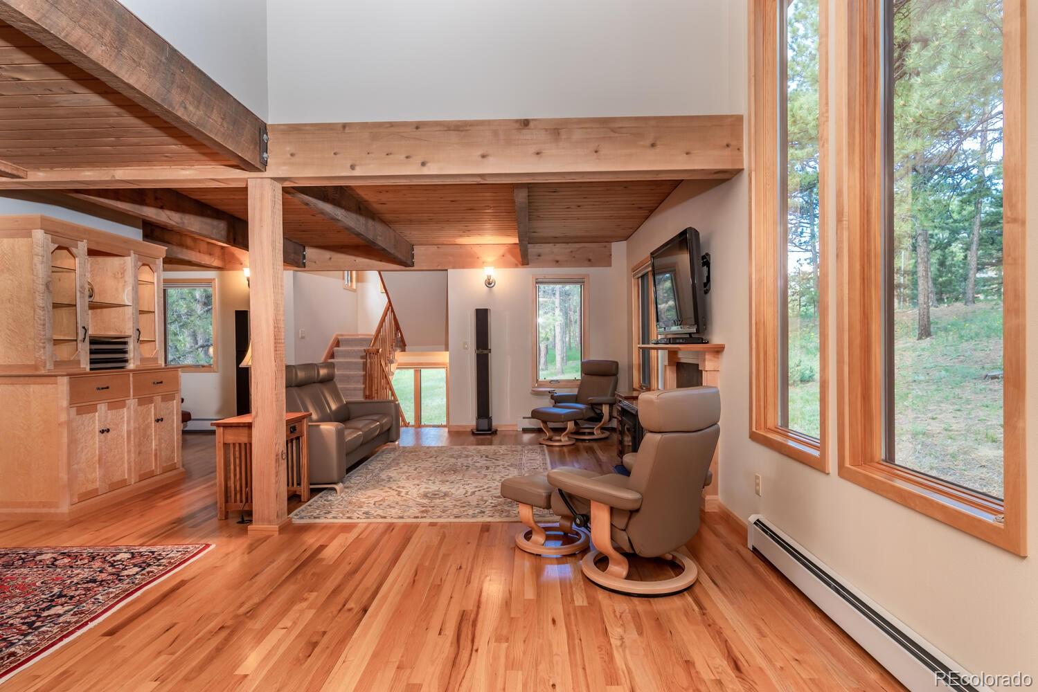 498 Mountain Meadows Road Boulder, CO 80302 - Photo 4 of 40 a view of a living room with furniture and wooden floor