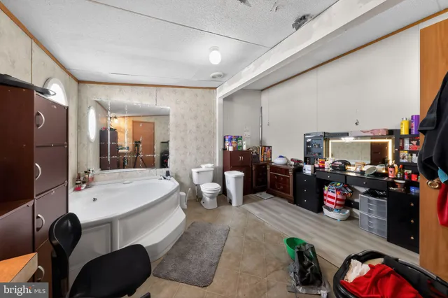 a room with gym equipment and a flat screen tv