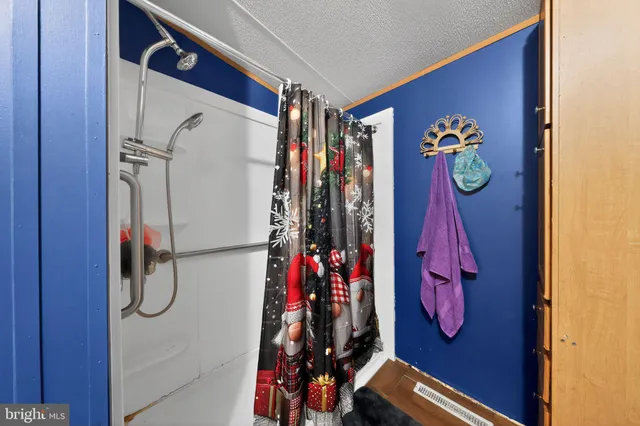 a view of walk in closet with clothes