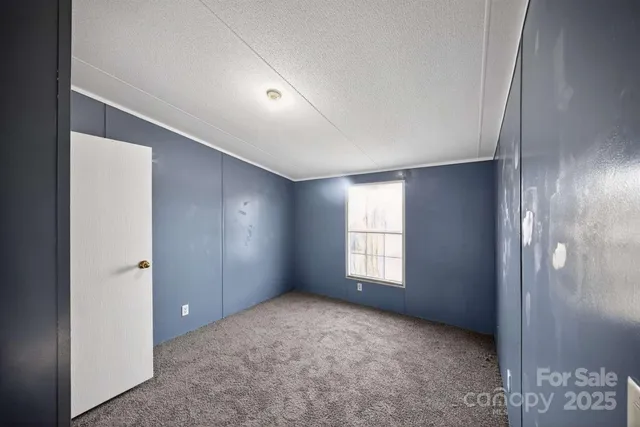 a view of empty room with windows