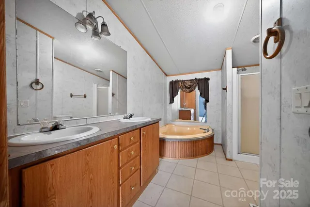 a spacious bathroom with a double vanity sink mirror and toilet