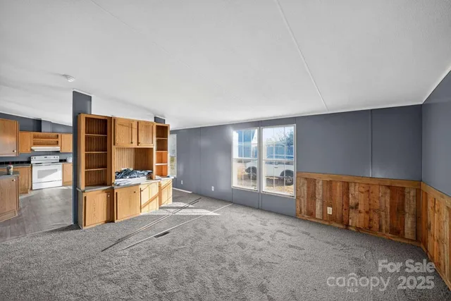 a view of an empty room with a fireplace