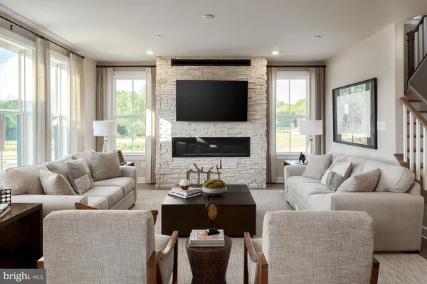a living room with furniture fireplace and a flat screen tv