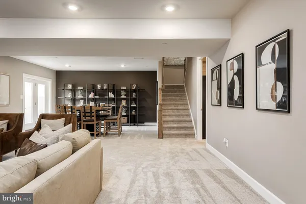 a bedroom with bed and a large window