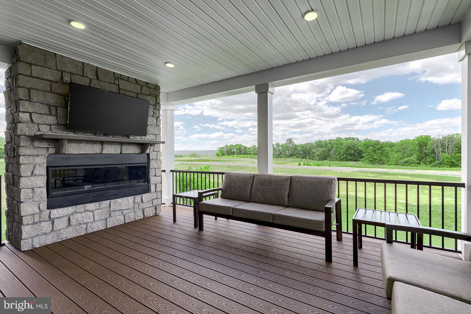 3100 Brazier Lane Exton, PA 19341 - Photo 34 of 35 a living room with furniture a flat screen tv and a fireplace
