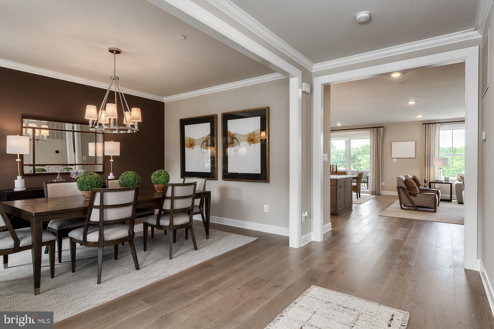3100 Brazier Lane Exton, PA 19341 - Photo 7 of 35 a view of a dining room and livingroom with furniture wooden floor a chandelier