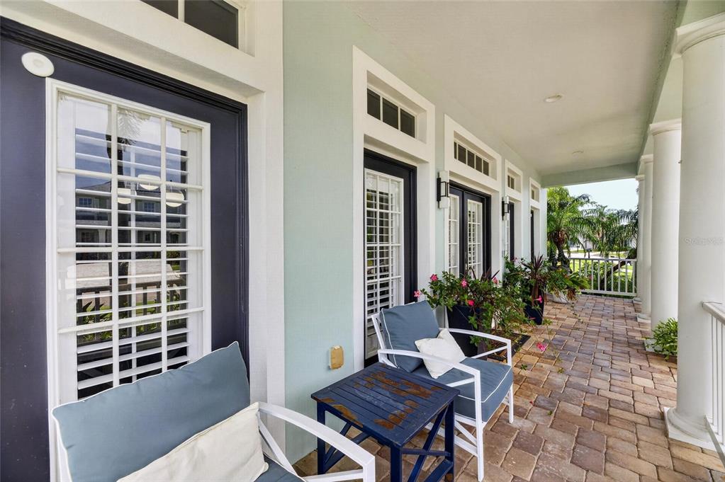 508 Islebay Drive Apollo Beach, FL 33572 - Photo 8 of 98 a view of a patio with table and chairs and potted plants