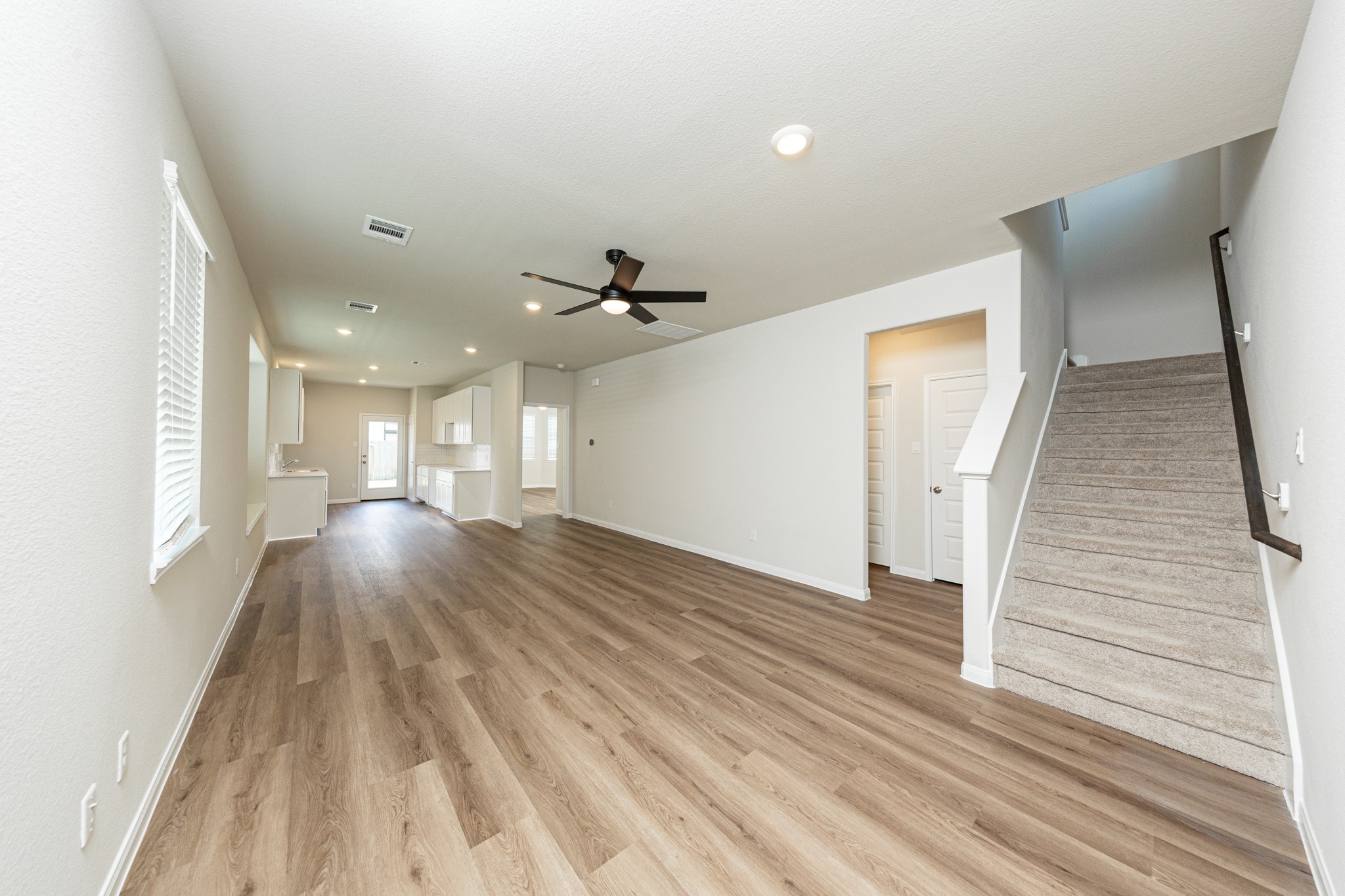 13651 Kit Run Splendora, TX 77372 - Photo 3 of 27 a view of a room with wooden floor and staircase