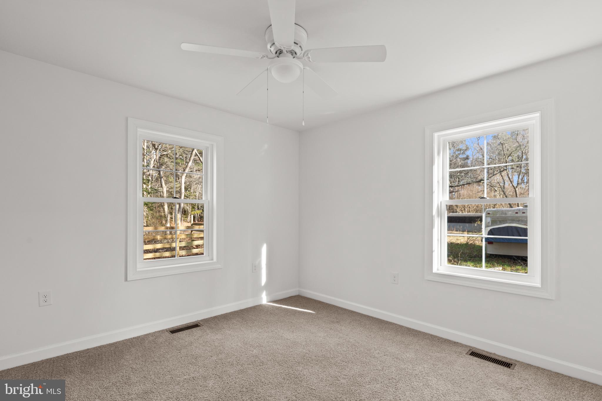 22202 Wetipquin Road Quantico, MD 21856 - Photo 15 of 28 an empty room with windows and closet