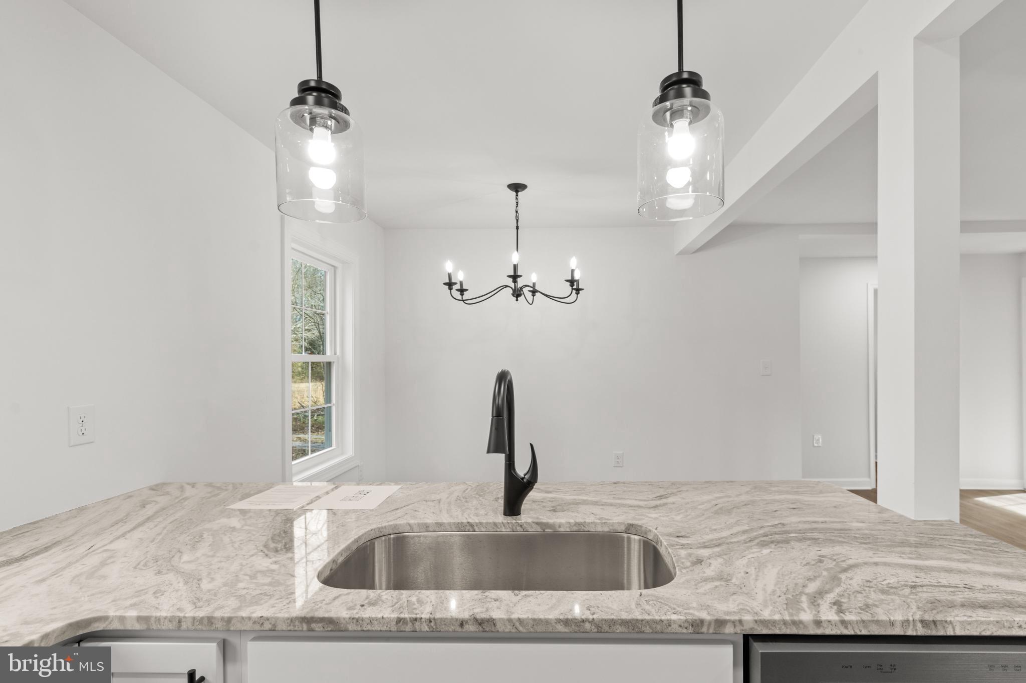 22202 Wetipquin Road Quantico, MD 21856 - Photo 21 of 28 a kitchen with a sink granite counter tops and a wooden floor