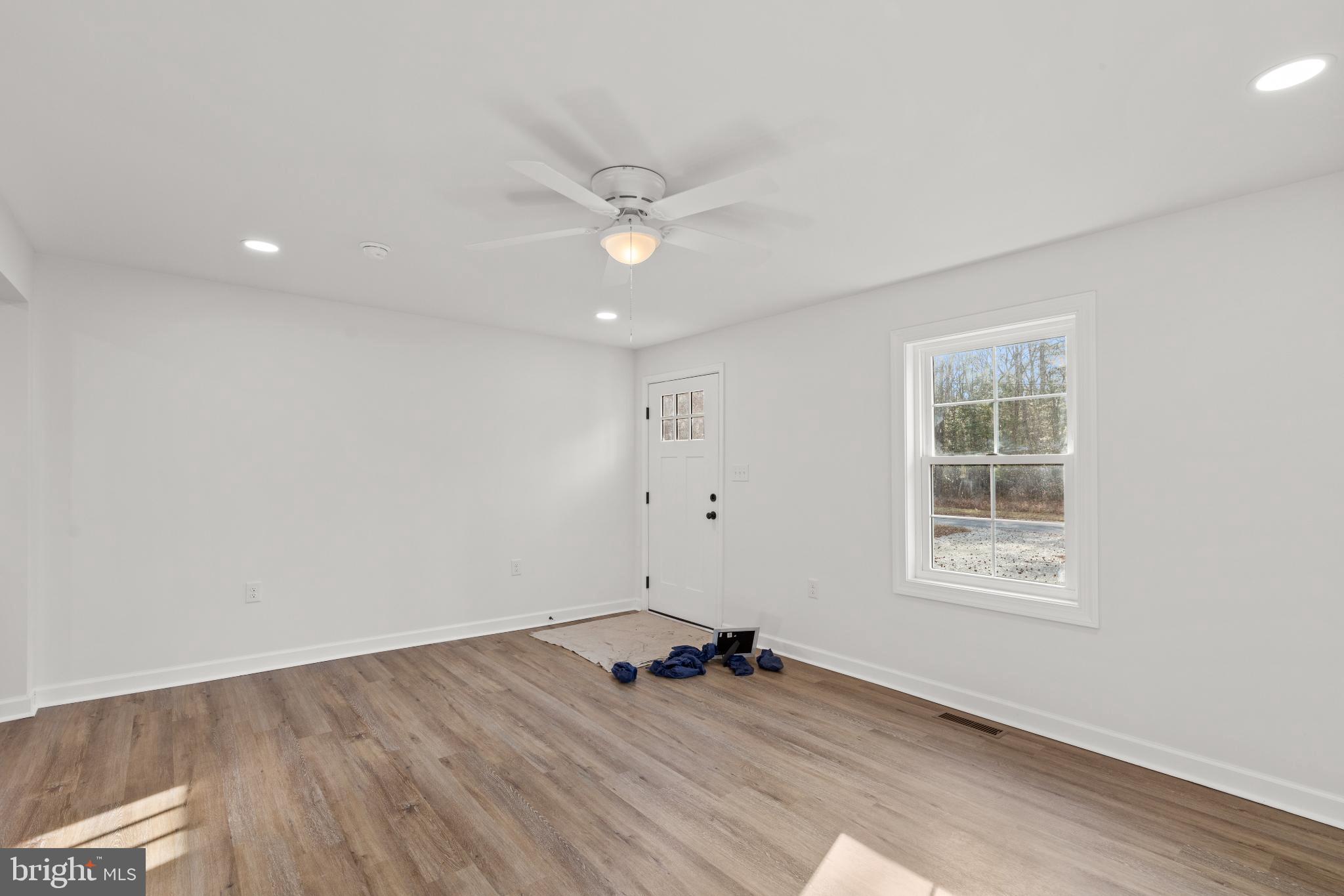 22202 Wetipquin Road Quantico, MD 21856 - Photo 24 of 28 a view of a big room with wooden floor and windows