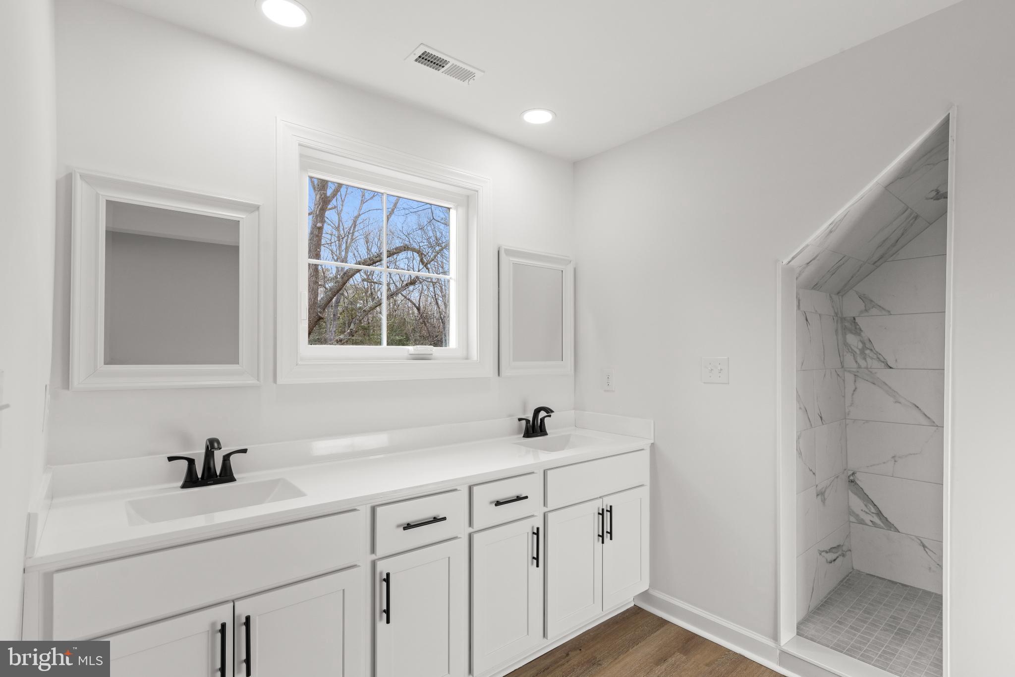 22202 Wetipquin Road Quantico, MD 21856 - Photo 6 of 28 a bathroom with 2 sink and a mirror