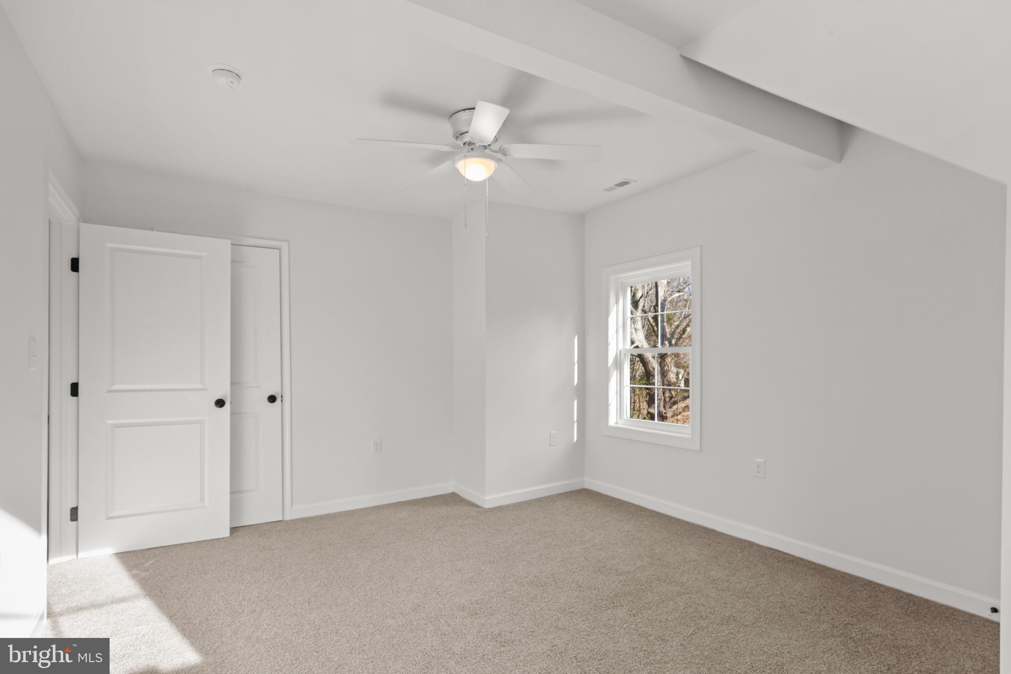 22202 Wetipquin Road Quantico, MD 21856 - Photo 7 of 28 a view of an empty room with a window