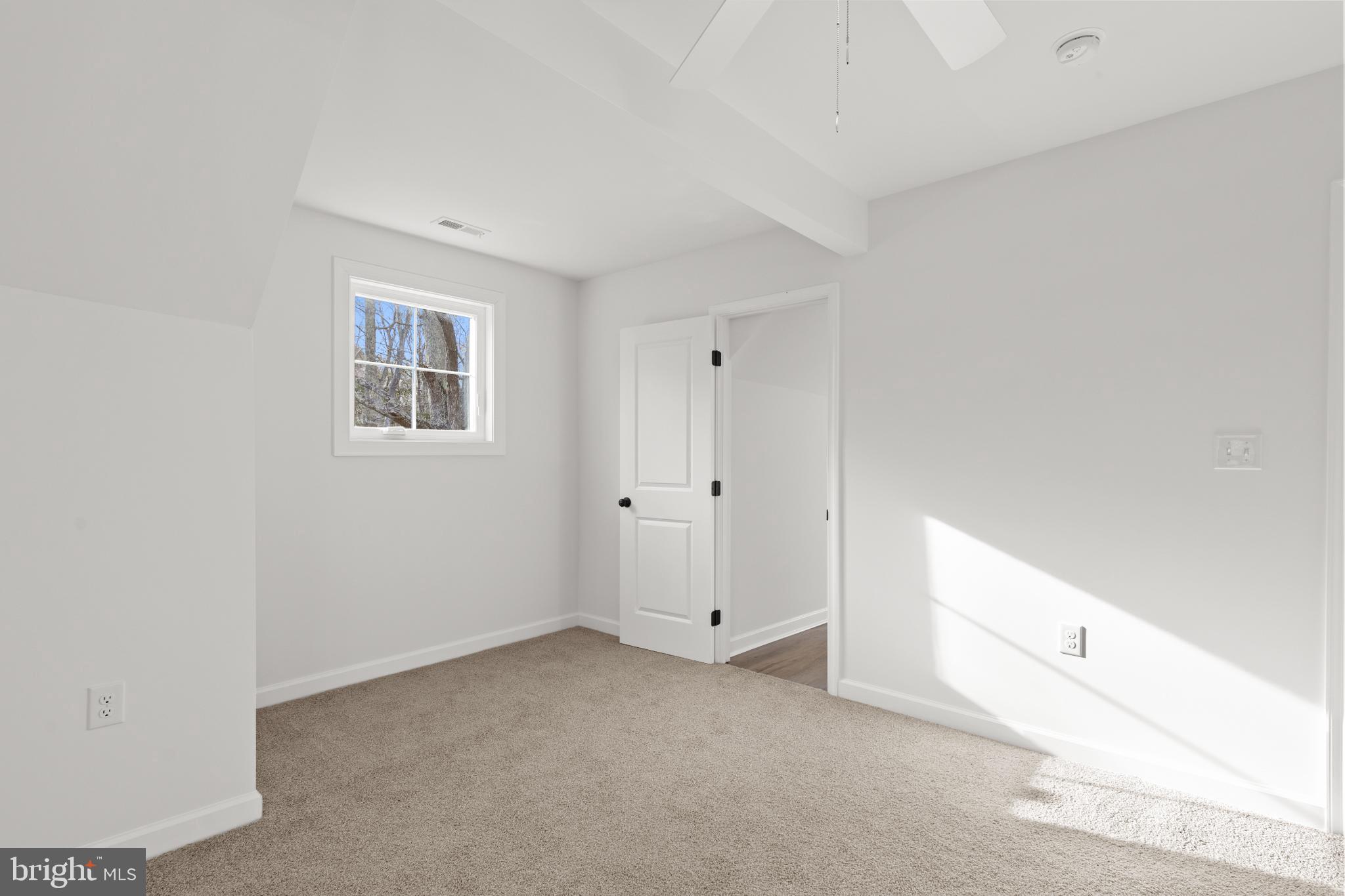 22202 Wetipquin Road Quantico, MD 21856 - Photo 9 of 28 a view of an empty room with a window