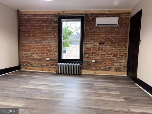 a view of outdoor space and wooden floor