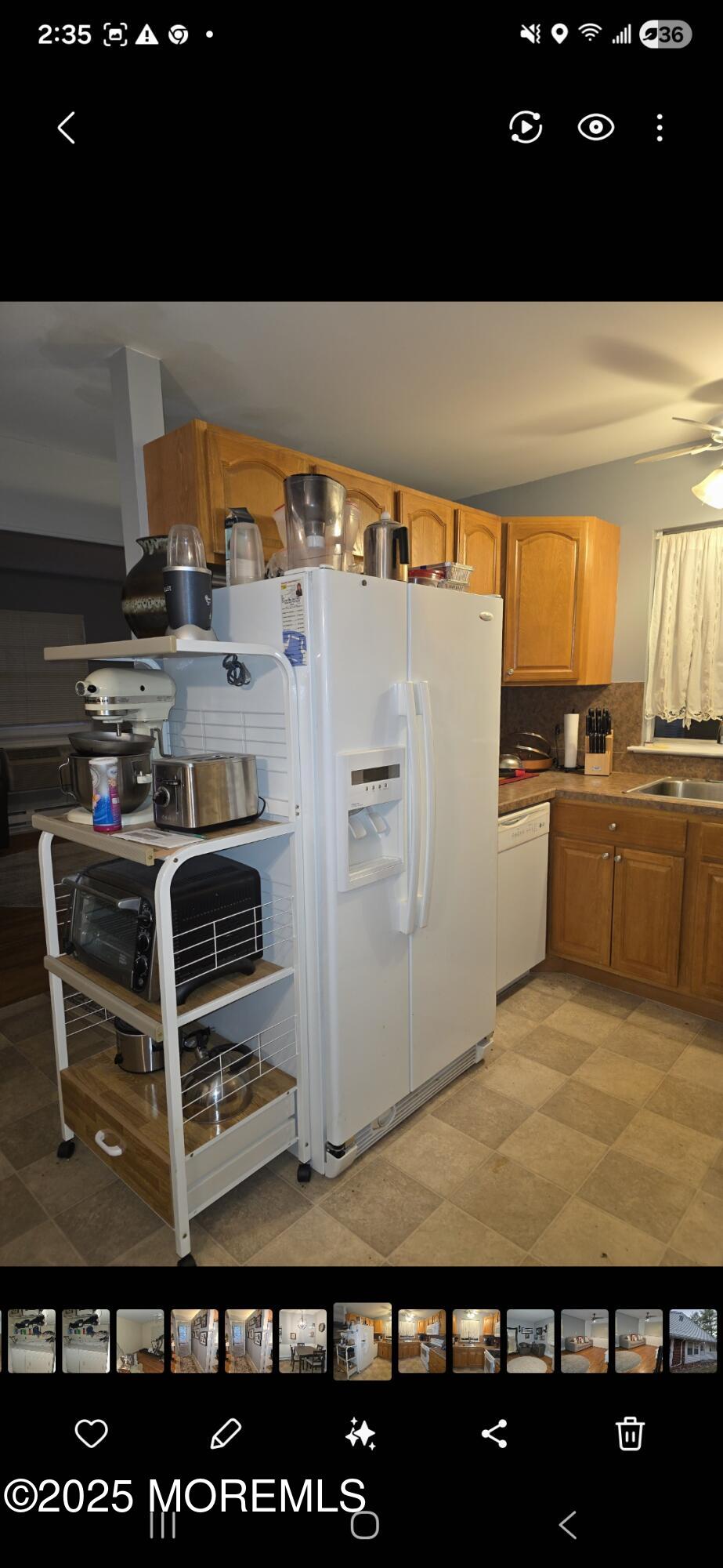 210 D Laurel Place Whiting, NJ 08759 - Photo 5 of 8 a view of kitchen with refrigerator stove and window