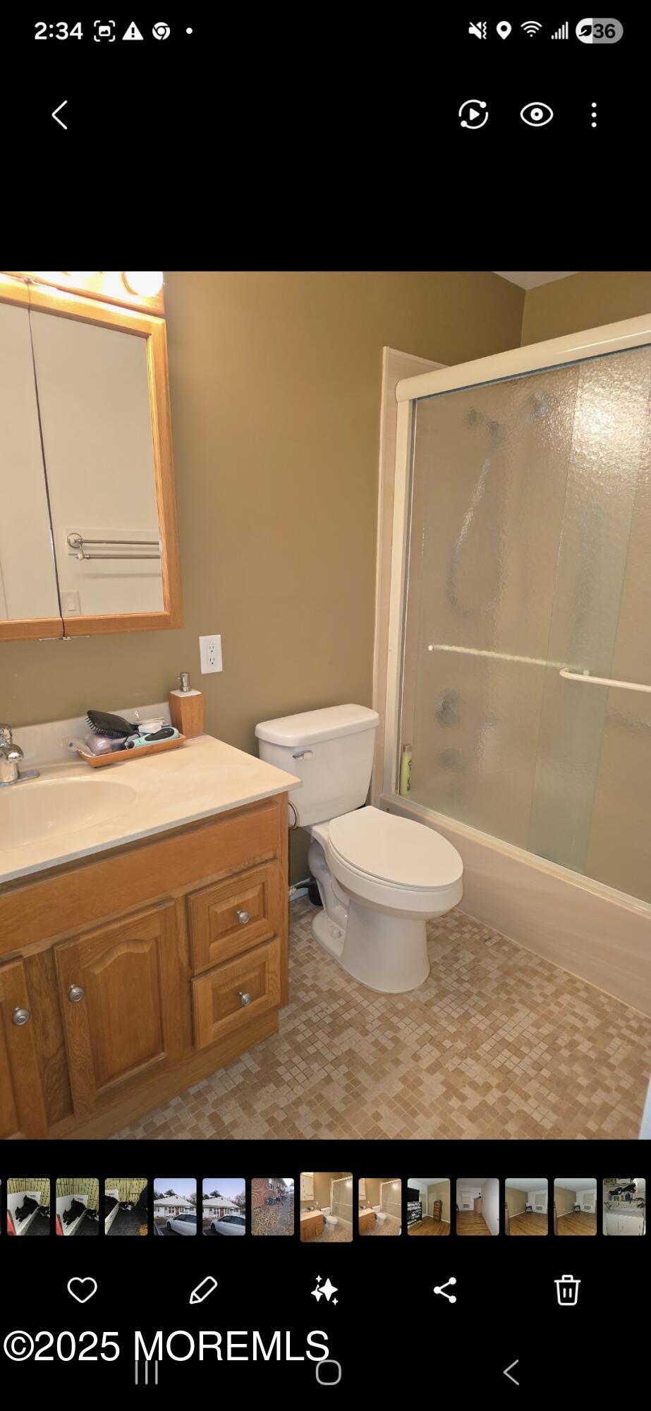 210 D Laurel Place Whiting, NJ 08759 - Photo 6 of 8 a bathroom with a granite countertop sink a toilet and a mirror