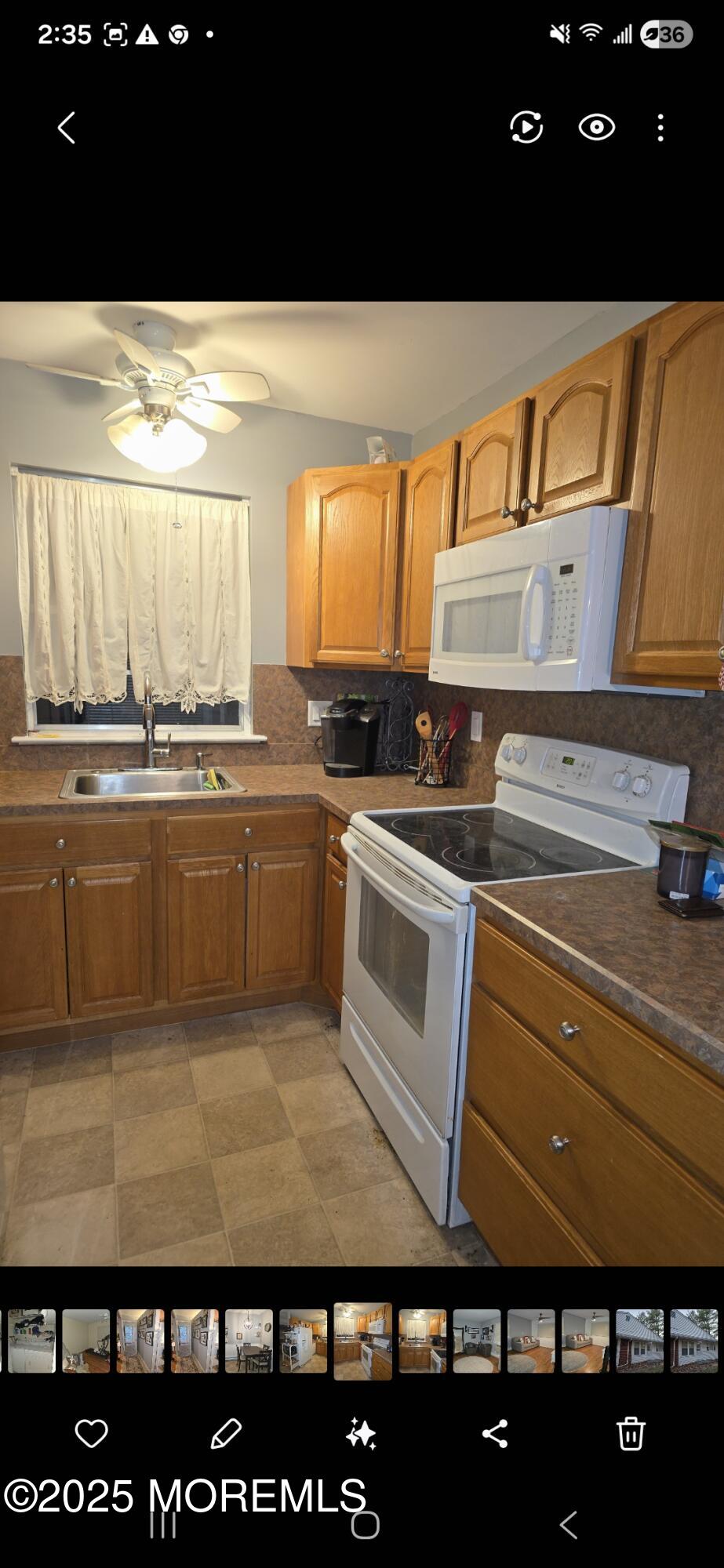 210 D Laurel Place Whiting, NJ 08759 - Photo 7 of 8 a kitchen with a sink and cabinets