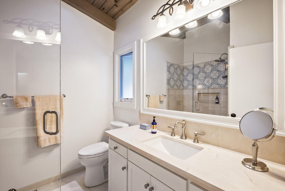 901 Cheltenham Road Santa Barbara, CA 93105 - Photo 17 of 27 a bathroom with a sink a toilet and a mirror