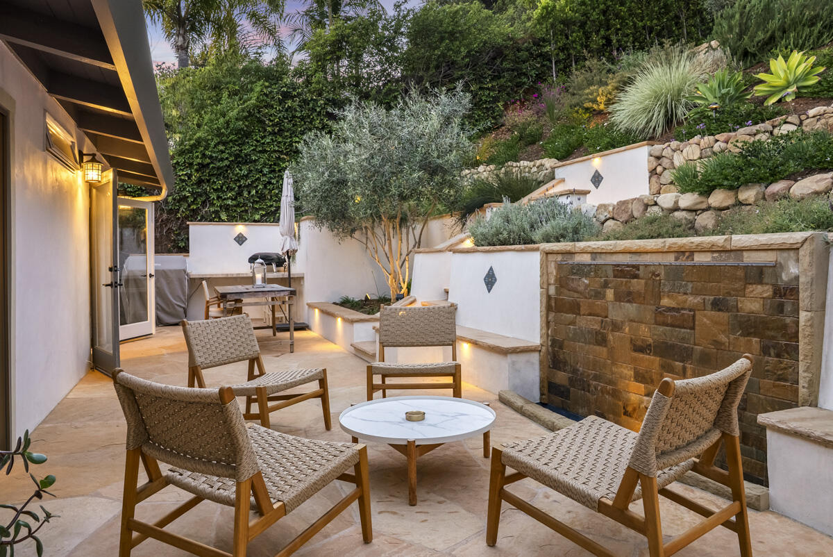 901 Cheltenham Road Santa Barbara, CA 93105 - Photo 24 of 27 a couple of chairs sitting in patio of a house