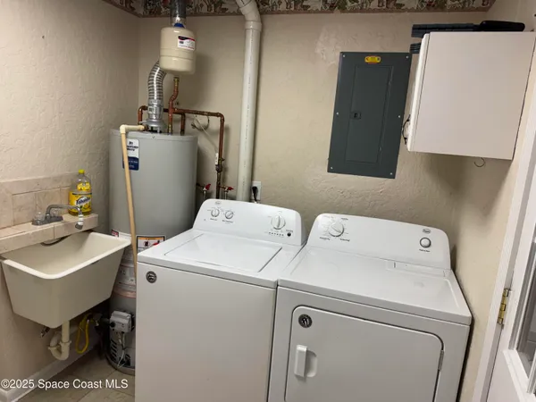 a bathroom with a sink toilet and a mirror