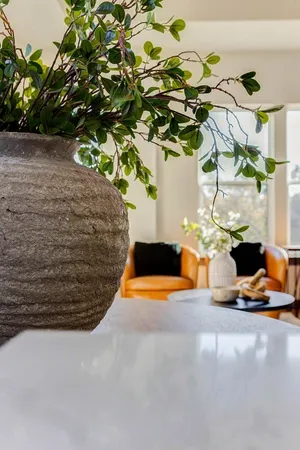 a vase of flowers sitting on a table
