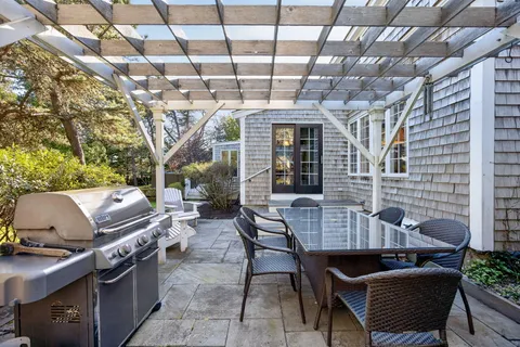 a view of a patio with a yard