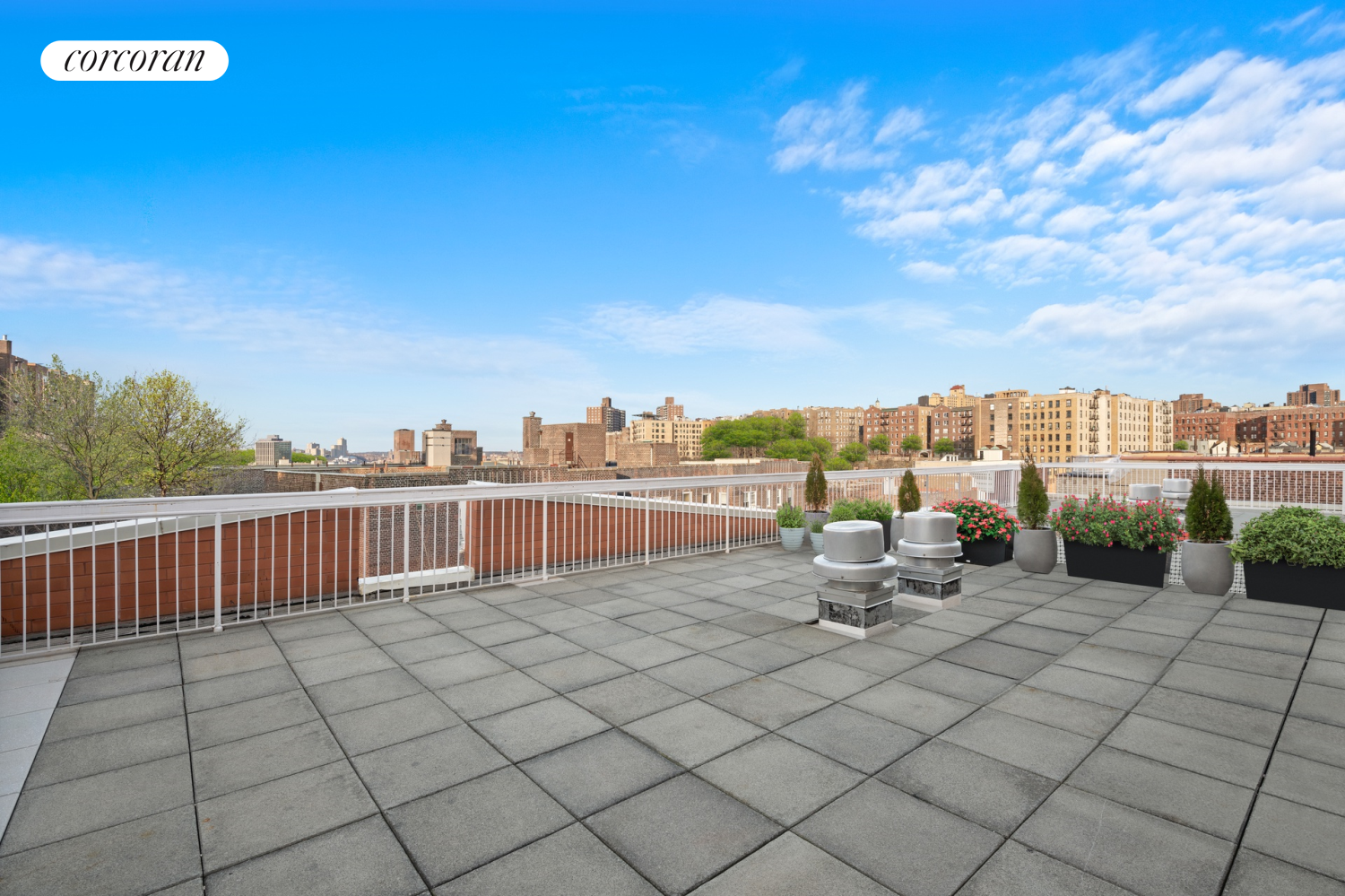 736 West 187th Street, Unit 108 Manhattan, NY 10033 - Photo 10 of 15 a view of roof deck with table and chairs