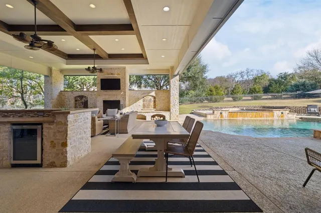 a outdoor space with patio furniture and a fireplace