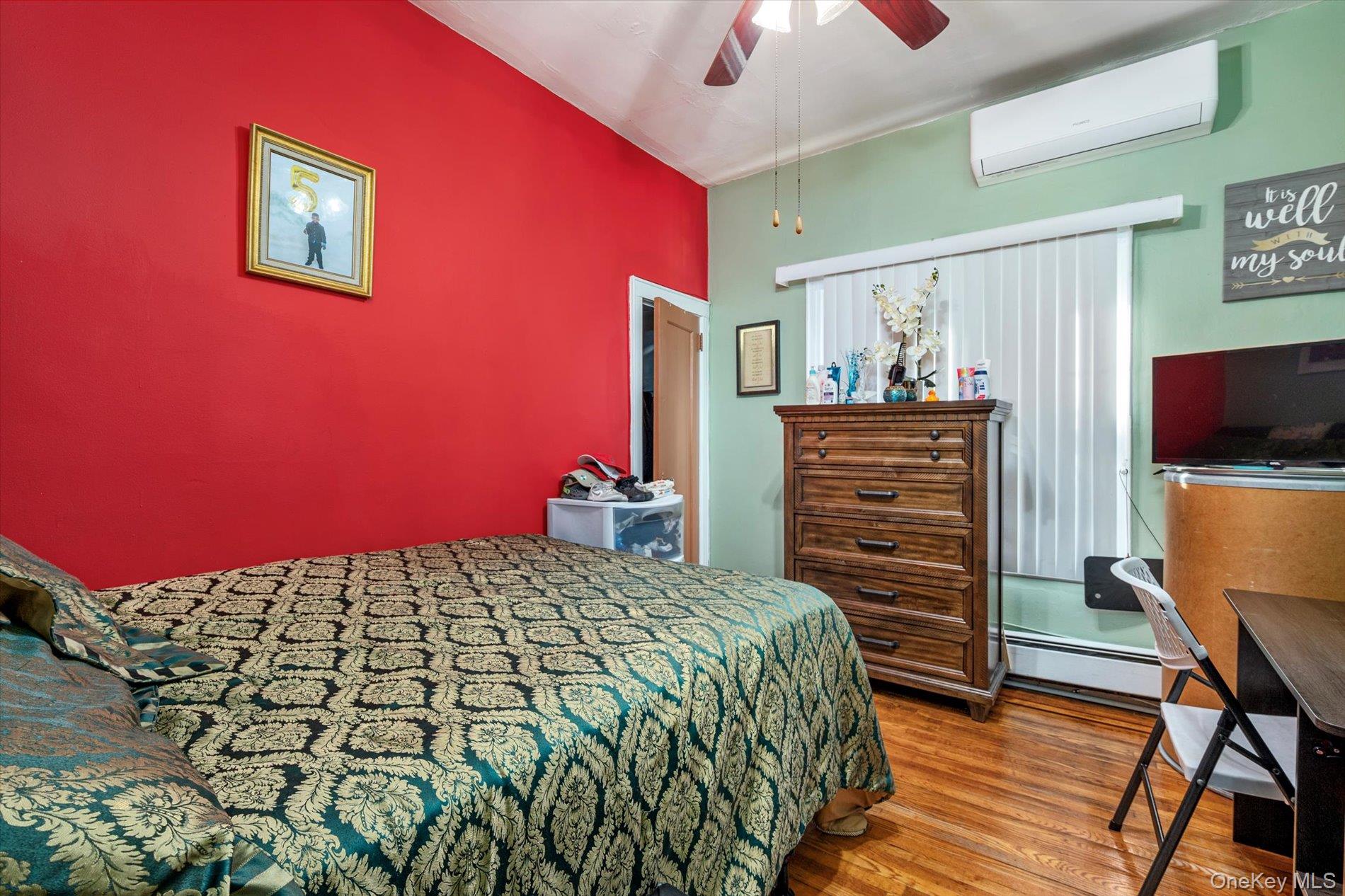 133-15 231st Street Queens, NY 11413 - Photo 11 of 22 a bedroom with a bed and a flat screen tv