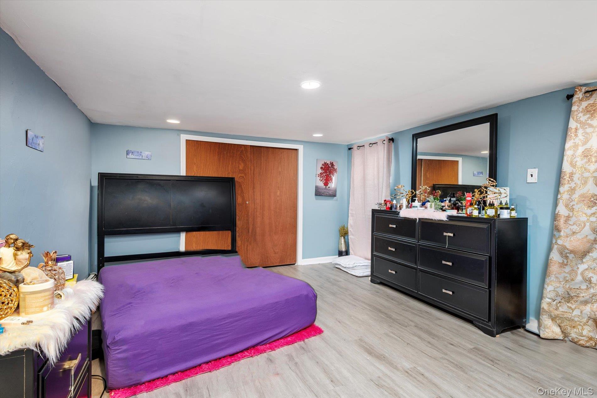 133-15 231st Street Queens, NY 11413 - Photo 14 of 22 a living room with furniture and a flat screen tv