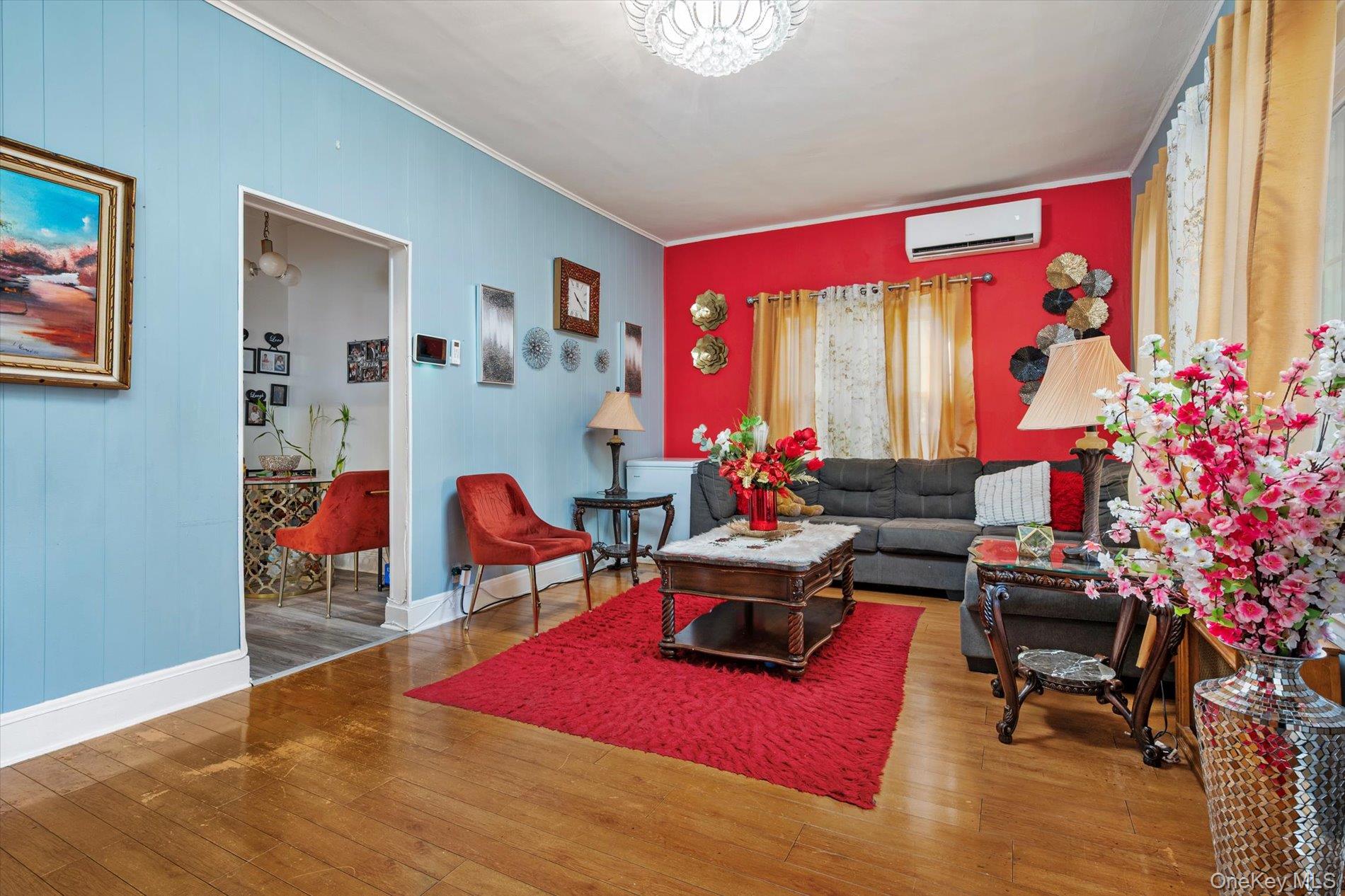 133-15 231st Street Queens, NY 11413 - Photo 4 of 22 a living room filled with furniture and a potted plant