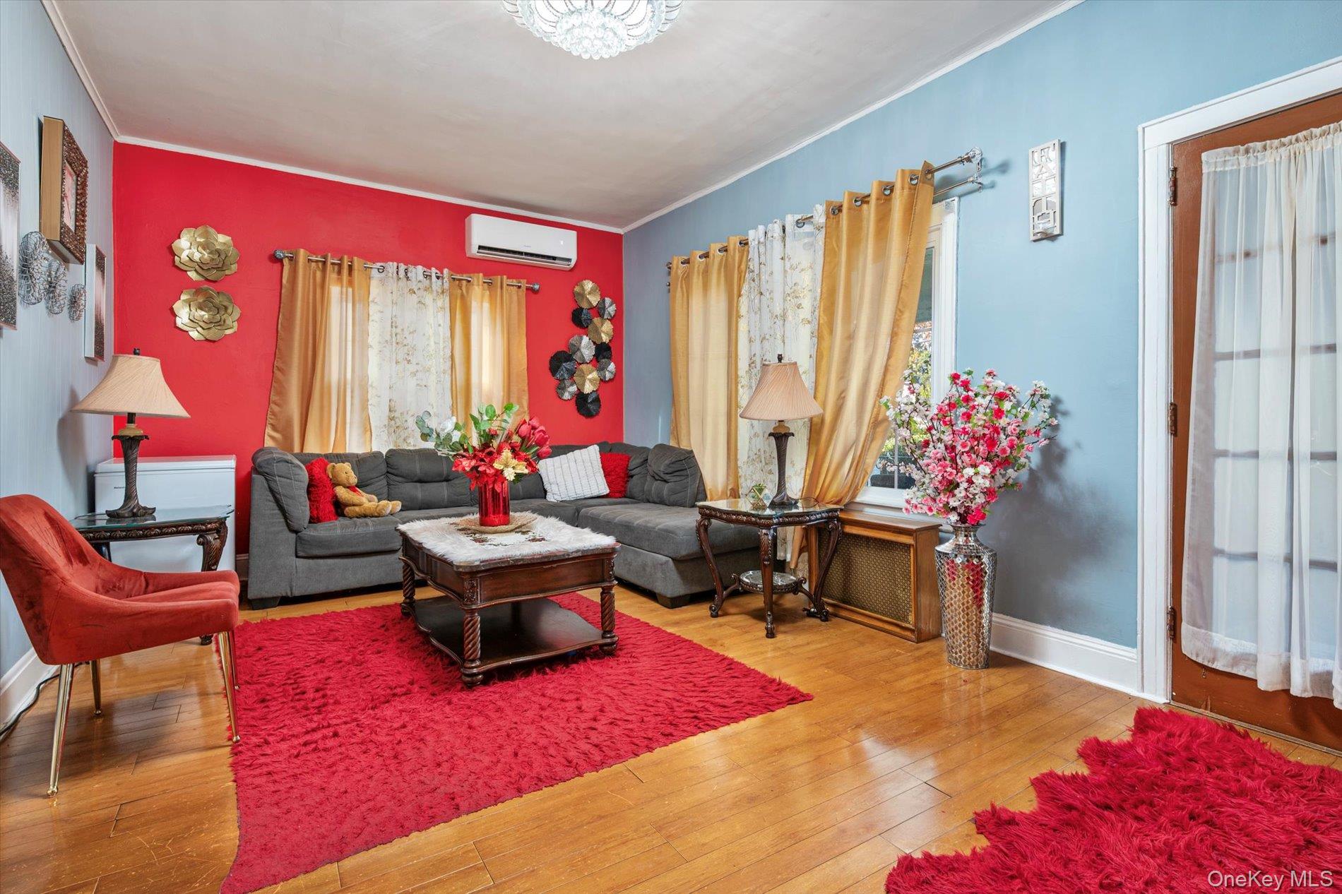 133-15 231st Street Queens, NY 11413 - Photo 5 of 22 a living room with furniture and a large window