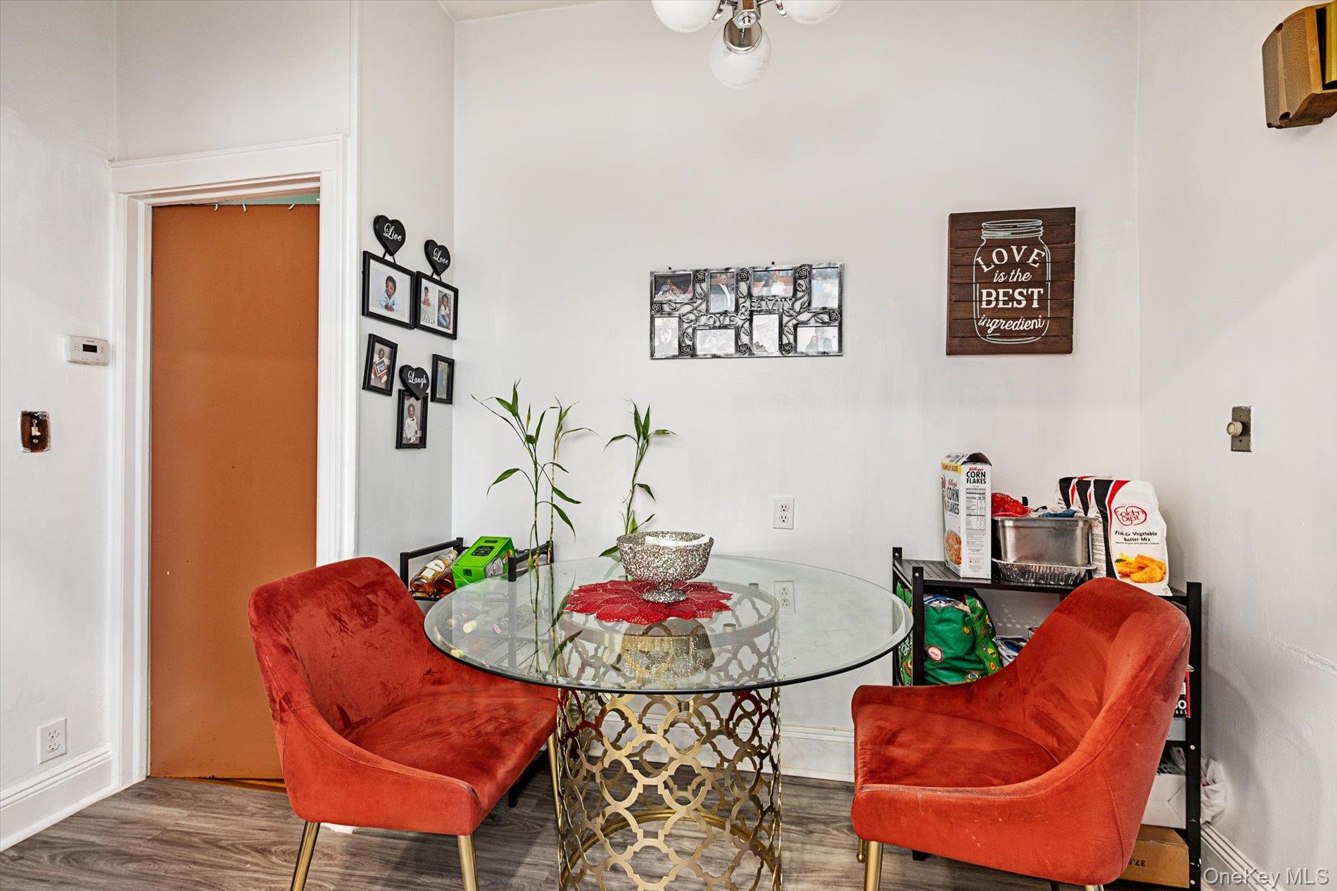 133-15 231st Street Queens, NY 11413 - Photo 10 of 22 a living room with furniture and kitchen view