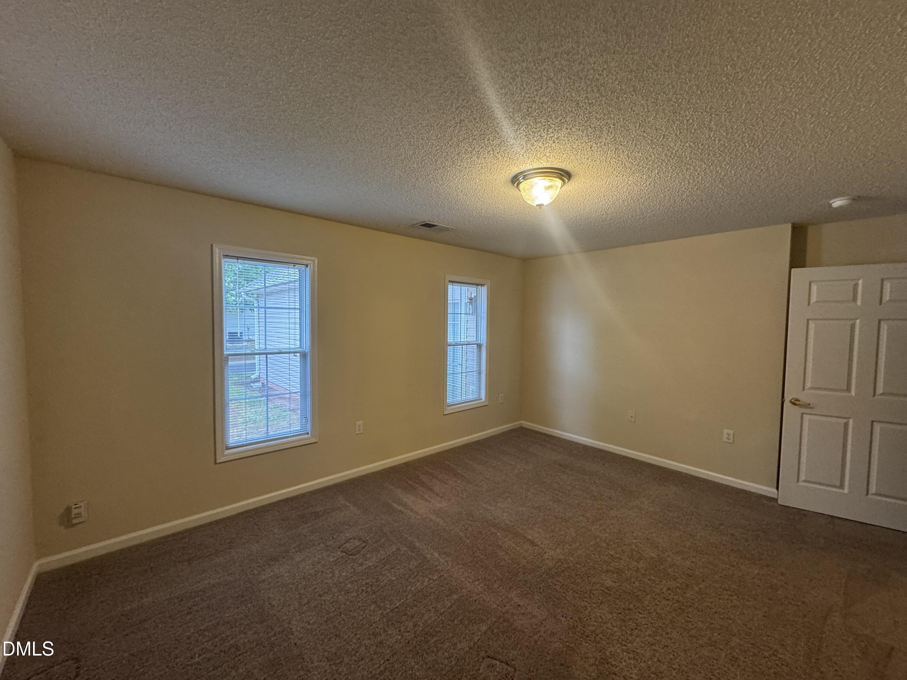 Undisclosed Address Raleigh, NC 27617 - Photo 16 of 22 an empty room with windows