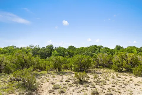 a view of a lake with a yard
