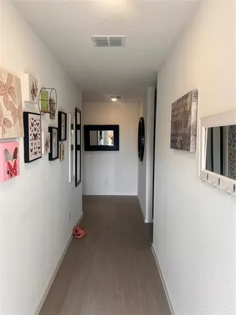 a view of a hallway with workspace