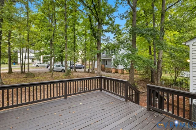 a view of a balcony with wooden floor