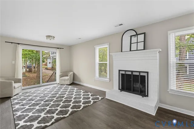 a bedroom with a bed and a fireplace