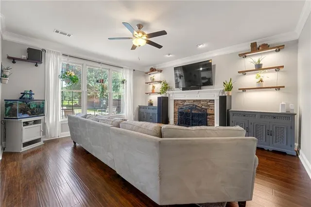a living room with furniture and a fireplace