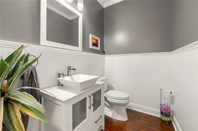 a bathroom with a sink toilet and vanity